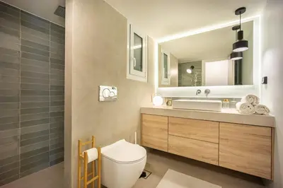 a bathroom with a toilet and a sink at Spacious 2BR in Koukaki l Balcony l Near Acropolis in Athens
