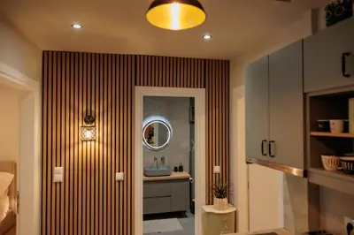 a bathroom with a sink and a mirror at Vintage-Inspired 2BDR Apt - 15' to Monastiraki in Athens
