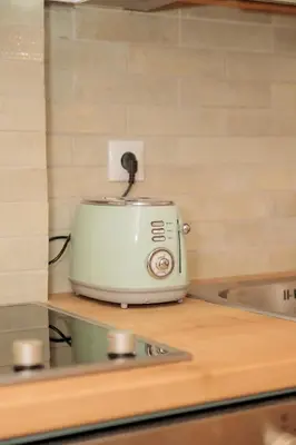 a toaster sitting on a counter in a kitchen at Vintage-Inspired 2BDR Apt - 15' to Monastiraki in Athens