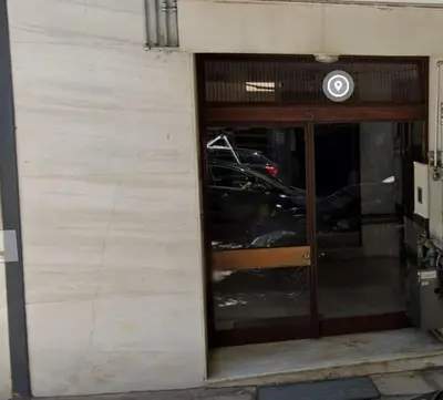 a door to a garage with a motorcycle inside at Acropolis Cityscape Loft in Athens