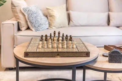 a chess board on a table in a living room at Marina Zeas Comfy Apartment in Piraeus