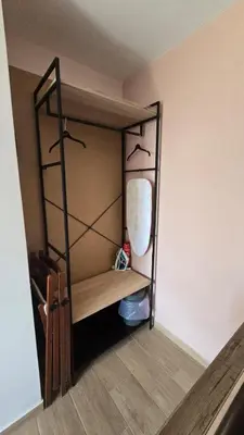 a small room with a shelf and a closet at Maria guesthouse in Spáta