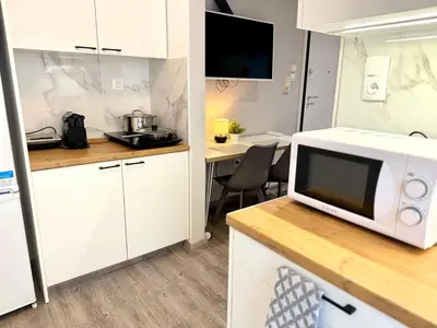 a microwave oven sitting on a counter in a kitchen at Athens Platonos Appartment in Athens