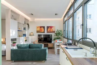 a living room with a couch and a table at Luxury Haven in the most ideal area of Athens in Athens