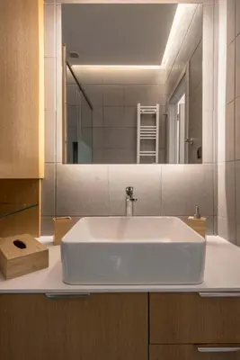 a bathroom with a white sink and a mirror at Luxury Haven in the most ideal area of Athens in Athens