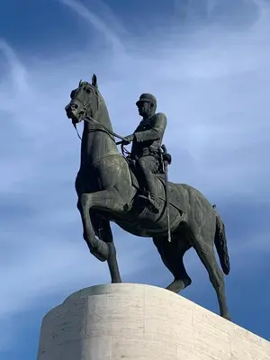 a statue of a man riding a horse at ARIS- Queen suite on the boulevard in Athens