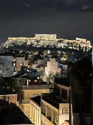 a view of the acropolis of athens at night at Lucas apartment 3 in Athens