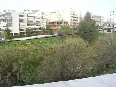 a view of a city with tall buildings at Cozy maisonette in Athinaiki Riviera of Palaio Faliro in Athens