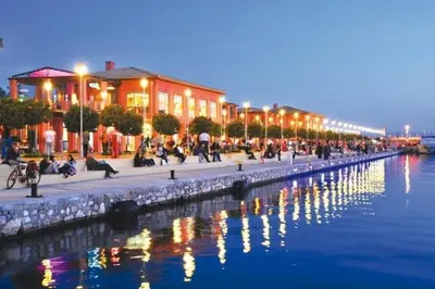 a group of buildings next to a body of water at Cozy maisonette in Athinaiki Riviera of Palaio Faliro in Athens