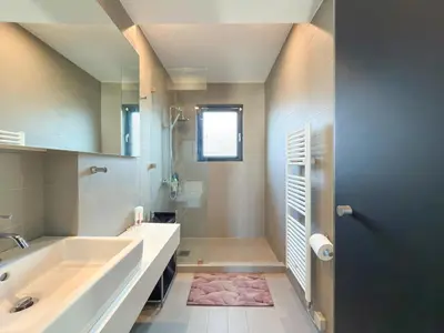 a bathroom with a large tub and a sink at Luxury Loft with Private Jacuzzi in Athens