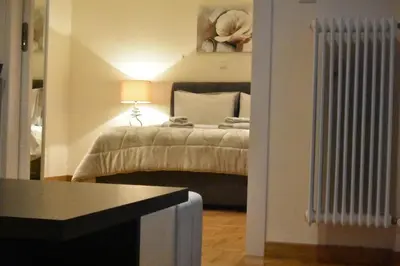 a bedroom with a bed with a lamp on it at Peaceful Retreat in Kolonaki in Athens