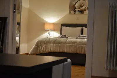 a bedroom with a bed with a lamp on it at Peaceful Retreat in Kolonaki in Athens