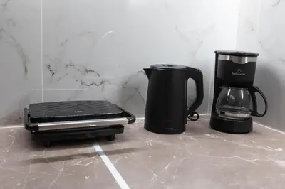 two coffee makers sitting on top of a counter at Boutique Apartment Τhe City Definition METRO 1 in Piraeus