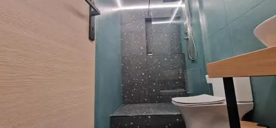 a bathroom with a shower with a toilet in it at New Ventiri Suite 6, near Hilton, Athens Central , 4 family & Bussines in Athens