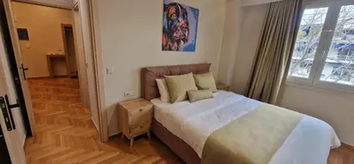 a bedroom with a bed and a window at New Ventiri Suite 6, near Hilton, Athens Central , 4 family & Bussines in Athens