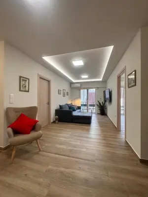 a living room with a couch and a chair at A Lux, Athens center, Syntagma! Work or Play in Athens