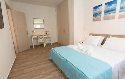 a bedroom with a bed and a table in it at A Lux, Athens center, Syntagma! Work or Play in Athens