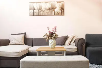 a living room with a couch and a table at New house in Piraeus in Piraeus