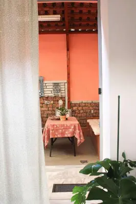 a table in a room with a red wall at New house in Piraeus in Piraeus