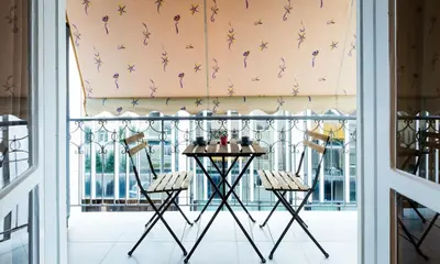 a room with a balcony with a table and chairs at YOUR BRAND NEW Awesome Acropolis Home in Athens