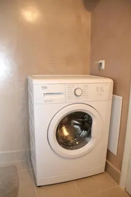 a washer and dryer in a small room at YOUR BRAND NEW Awesome Acropolis Home in Athens