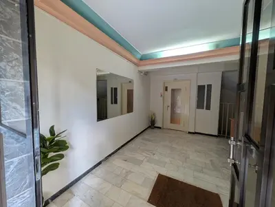a hallway with white walls and a blue ceiling at Aneto Edem in Athens