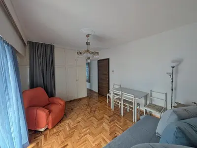 a living room with a couch and a table at Aneto Edem in Athens