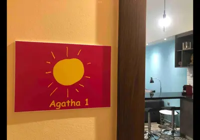 a sign on the door of a room at Agatha-1 in Piraeus