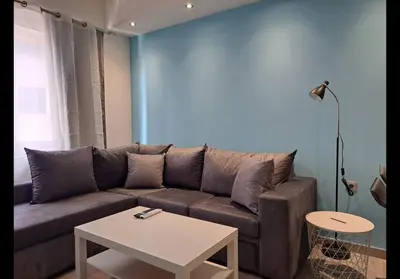 a living room with a couch and a table at Agatha-1 in Piraeus