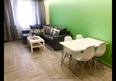 a living room with a couch and a table at Agatha-2 in Piraeus