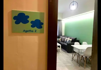 a room with a table and a living room at Agatha-2 in Piraeus