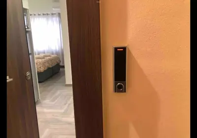 a door to a room with a room with a bed at Agatha-2 in Piraeus