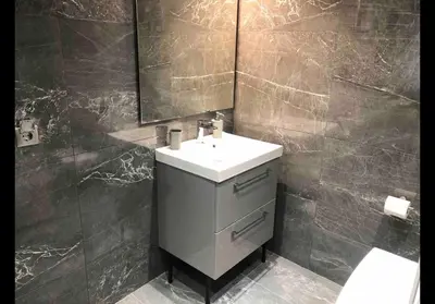 a bathroom with a sink and a mirror at Agatha-2 in Piraeus