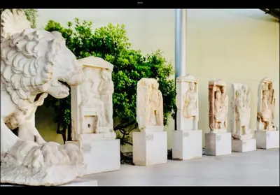 a stone lion statue in a museum with other statues at Agatha-3 in Piraeus