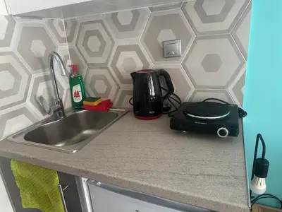 a kitchen counter with a sink and a toaster at Agatha-3 in Piraeus
