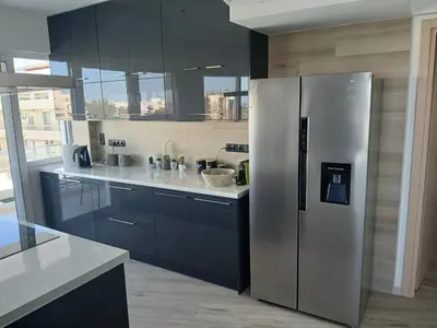 a kitchen with a stainless steel refrigerator at Utopia Suit in Athens