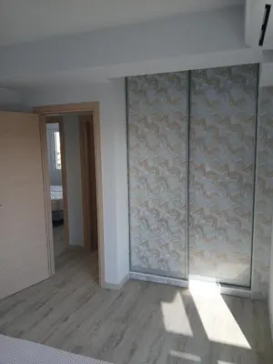 an empty room with a wall with fish painted on it at Utopia Suit in Athens