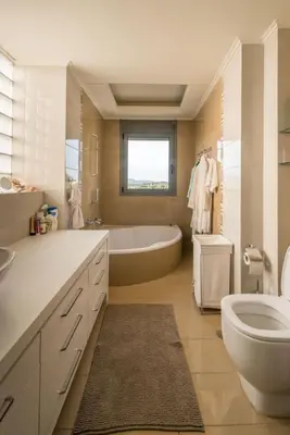 a bathroom with a tub and a toilet and a sink at Superb Athens Airport Residence, Unique View in Spáta