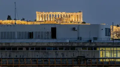 a building in the background with a building in the background at Rooftops of Athens - Vathi Studio Jacuzzi & View in Athens
