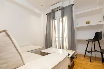 a living room with a couch and a chair at Nova Domo in Athens