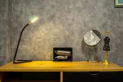 a desk with a lamp and a mirror on it at Sophisticated Penthouse and breakfast items in Athens