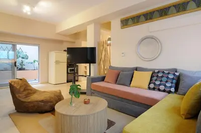 a living room with a couch and a table at Arditos Hill Residence in Athens