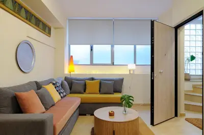 a living room with a couch and a table at Arditos Hill Residence in Athens
