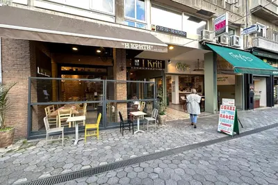 a woman walking in front of a store at Panoramic View Athenian Loft in Athens