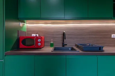a kitchen with a red microwave and a sink at Panoramic View Athenian Loft in Athens