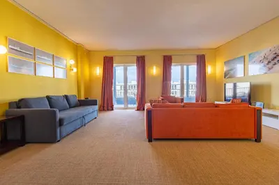 a living room with two couches and a tv at Panoramic View Athenian Loft in Athens