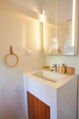 a bathroom with a sink and a mirror at Camara Athens Riviera Home in Aghia Marina