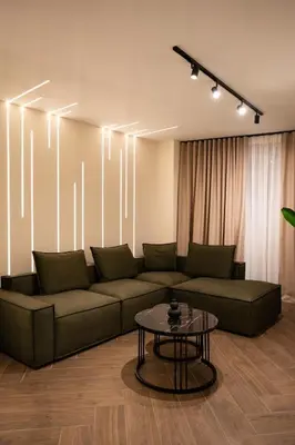 a living room with a couch and a table at Kalma Luxury Living Athens in Athens