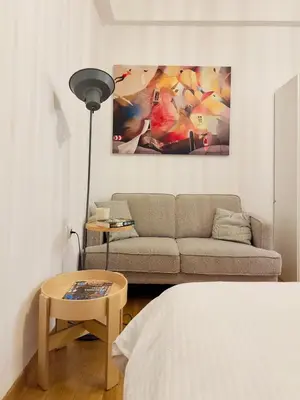 a living room with a couch and a table at Eclectic Studio Exarcheia for 2 in Athens