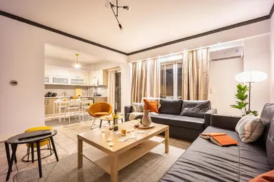 a living room with a couch and a table at Perfect Stay in Gazi in Athens